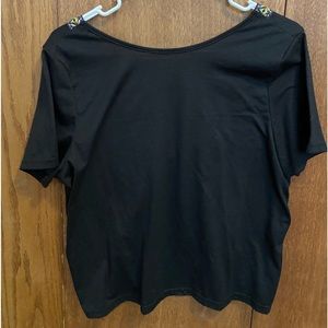 NWOT black open back shirt.